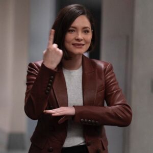 Sandra Mae Frank Instagram - What is Dr. Wilder saying in this photo? 😉

Tune in TONIGHT at 10/9c on @NBC, next day on @PeacockTV and @Hulu 👩🏻‍⚕️ 

#NewAmsterdam #DamFam #DrWilder

[image description]
Sandra Mae as Dr. Wilder in a leather red jacket with a gray t-shirt underneath, chin-length brown hair, and she slightly smiles saying something.