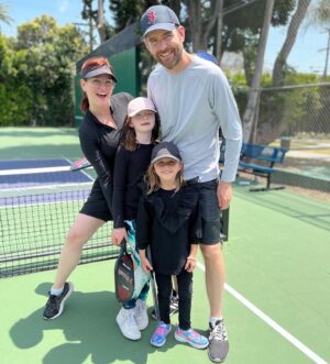Sara Rue Instagram - The family that pickles together.... My new life goal is to become the partridge family of #pickleball. (👋🏻Looking for a sponsor before we hit the pro circuit) 🏓🥒Thank you @domainela for the best family pic ever! #pickelballislife #mothersdaygift #mommywantstopickle #mothersdaypickleball