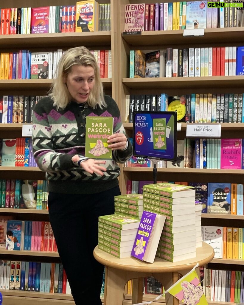 Sara Pascoe Instagram - Good old @whsmithofficial have made Weirdo their Book of the Moment and I wore a jumper that matched the front covers just like Rushdie or Nabokov would do. When I was 16 I worked in the Romford branch of WHSmith and this is such a full circle moment for me that it feels like something crazy my brain has made up. So very fitting for this novel. 📖📚