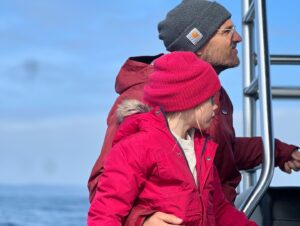 Sarah Carter Instagram - A dream came true for me last Sunday. 

We met a Blue Whale named Uno… the largest mammal in the world… most rare… gentle giant with a 1000 lbs heart. 

It was a cold and cloudy day. We changed our trip from 1pm to 3:30pm.  You can only see the blue glow emanate off of their stone grey skin when the sun hits the ocean surface.  Managing expectations, the guides acknowledged the gloomy weather, and said a sighting isn’t guaranteed, but if we do see a 30 or 40ft spray in the distance to let them know so we can race towards it and catch its dive… its tail. We were told there were four in the area, but none had shown their tail as of yet.  When they reassured we’d likely see dolphins… I knew in my gut I was there for the Blue Whale… they migrate through the California coast two weeks out of the year (some years) and they were here. 

This animal has intrigued me throughout my life. To see it now… after so much family healing…after my brother’s passing and the depth of forgiveness, loyalty, and love his transition unearthed… this was yet another sacred connection with natural medicine I didn’t expect.

Uno had an injury… part of his tail was missing so his dives were shallow and he moved slowly… he needed to use his tail to dive for krill… after his first dive they told us he may not show again for another 12 to 20 minutes and depending on how fast he moves, that may have been it. 

5 minutes later, the sun came pouring through the clouds and his spout sounded right beside our boat. The blue glow was like nothing I could have imagined. Dave, our guide told us to put away our phones and enjoy it, and that he would take drone shots for us. The beauty was almost overwhelming. 

Just when we thought it couldn’t get any better, he showed his tail again! I took out my phone… and again… this time I captured Alice’s joy.

I feel honored to be able to share this experience with you. If you ever have the chance, @newportcoastaladventure is well worth the trip.

“When the student is ready, the teacher appears.”

Thank you Uno.

You opened my heart into greatness, slowness, grace, beauty, strength, loyalty, connection, wisdom, and the vast unknown.

#keepouroceansclean