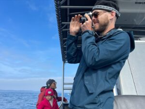 Sarah Carter Instagram - A dream came true for me last Sunday. 

We met a Blue Whale named Uno… the largest mammal in the world… most rare… gentle giant with a 1000 lbs heart. 

It was a cold and cloudy day. We changed our trip from 1pm to 3:30pm.  You can only see the blue glow emanate off of their stone grey skin when the sun hits the ocean surface.  Managing expectations, the guides acknowledged the gloomy weather, and said a sighting isn’t guaranteed, but if we do see a 30 or 40ft spray in the distance to let them know so we can race towards it and catch its dive… its tail. We were told there were four in the area, but none had shown their tail as of yet.  When they reassured we’d likely see dolphins… I knew in my gut I was there for the Blue Whale… they migrate through the California coast two weeks out of the year (some years) and they were here. 

This animal has intrigued me throughout my life. To see it now… after so much family healing…after my brother’s passing and the depth of forgiveness, loyalty, and love his transition unearthed… this was yet another sacred connection with natural medicine I didn’t expect.

Uno had an injury… part of his tail was missing so his dives were shallow and he moved slowly… he needed to use his tail to dive for krill… after his first dive they told us he may not show again for another 12 to 20 minutes and depending on how fast he moves, that may have been it. 

5 minutes later, the sun came pouring through the clouds and his spout sounded right beside our boat. The blue glow was like nothing I could have imagined. Dave, our guide told us to put away our phones and enjoy it, and that he would take drone shots for us. The beauty was almost overwhelming. 

Just when we thought it couldn’t get any better, he showed his tail again! I took out my phone… and again… this time I captured Alice’s joy.

I feel honored to be able to share this experience with you. If you ever have the chance, @newportcoastaladventure is well worth the trip.

“When the student is ready, the teacher appears.”

Thank you Uno.

You opened my heart into greatness, slowness, grace, beauty, strength, loyalty, connection, wisdom, and the vast unknown.

#keepouroceansclean