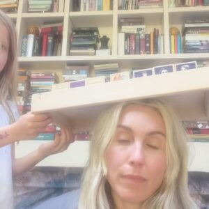 Sarah Carter Instagram - Peace and love from my living room…

Lately, I have felt like the world I see here on IG is not the world I want to perpetuate.  There is light and love everywhere I look as much as there is darkness and disgrace. The block set we are playing with in these photos is called “women who dared”… dared to rebel for love, speak truth, share wisdom, and new ways.

My gorgeous white wolf-like-creature commonly referred to as a dog is so calm in these photos and yet she digs up the garden, escapes, causes upheaval in the community and like any child she inconveniently demands attention, but she is a part of us and lives for these lazy hours of nothingness and togetherness. 

So excited to learn that in the 6th grade I played Dorothy in The Wizard of Oz, Alice wanted to dress up as Dorthy and “practice” to send my school friends from Winnipeg a karaoke video.  Her purity and the song itself brought me to tears as I realized how formative and prevalent Somewhere Over the Rainbow remains to my spirit. 

I now host women’s circles and have for two decades to bring us in closer touch with our creative and healing natures… home to ourselves.  The learning is age old to face our own darkness to find our way through to self-realization/freedom, but also that we are not meant to be alone.  Our unique paths and gifts are essential to the whole. We are designed to find beauty in our pain by sharing.

I hope this post inspires your own softeness and slowness this weekend… to remind yourself that you can find your way back home.

In the YouTube lineup after the kareoke video, a post of my now husband Kevin and I singing together randomly popped up. I hadn’t seen it since before Alice was born and needed to… to be reminded of the original bond between us that has bore so much fruit in spite of incredible challenges and heartbreaks… the song, too, is about mother love… unconditional love… where we come from before the confusion… a return home.

And finally, an exercise I offered to the women in my circle last week: Write yourself a letter of encouragement from your Dreamer. We all need to feel less lost. What if you were right where you belong? Give yourself some recognition.