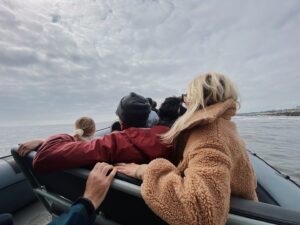 Sarah Carter Instagram - A dream came true for me last Sunday. 

We met a Blue Whale named Uno… the largest mammal in the world… most rare… gentle giant with a 1000 lbs heart. 

It was a cold and cloudy day. We changed our trip from 1pm to 3:30pm.  You can only see the blue glow emanate off of their stone grey skin when the sun hits the ocean surface.  Managing expectations, the guides acknowledged the gloomy weather, and said a sighting isn’t guaranteed, but if we do see a 30 or 40ft spray in the distance to let them know so we can race towards it and catch its dive… its tail. We were told there were four in the area, but none had shown their tail as of yet.  When they reassured we’d likely see dolphins… I knew in my gut I was there for the Blue Whale… they migrate through the California coast two weeks out of the year (some years) and they were here. 

This animal has intrigued me throughout my life. To see it now… after so much family healing…after my brother’s passing and the depth of forgiveness, loyalty, and love his transition unearthed… this was yet another sacred connection with natural medicine I didn’t expect.

Uno had an injury… part of his tail was missing so his dives were shallow and he moved slowly… he needed to use his tail to dive for krill… after his first dive they told us he may not show again for another 12 to 20 minutes and depending on how fast he moves, that may have been it. 

5 minutes later, the sun came pouring through the clouds and his spout sounded right beside our boat. The blue glow was like nothing I could have imagined. Dave, our guide told us to put away our phones and enjoy it, and that he would take drone shots for us. The beauty was almost overwhelming. 

Just when we thought it couldn’t get any better, he showed his tail again! I took out my phone… and again… this time I captured Alice’s joy.

I feel honored to be able to share this experience with you. If you ever have the chance, @newportcoastaladventure is well worth the trip.

“When the student is ready, the teacher appears.”

Thank you Uno.

You opened my heart into greatness, slowness, grace, beauty, strength, loyalty, connection, wisdom, and the vast unknown.

#keepouroceansclean