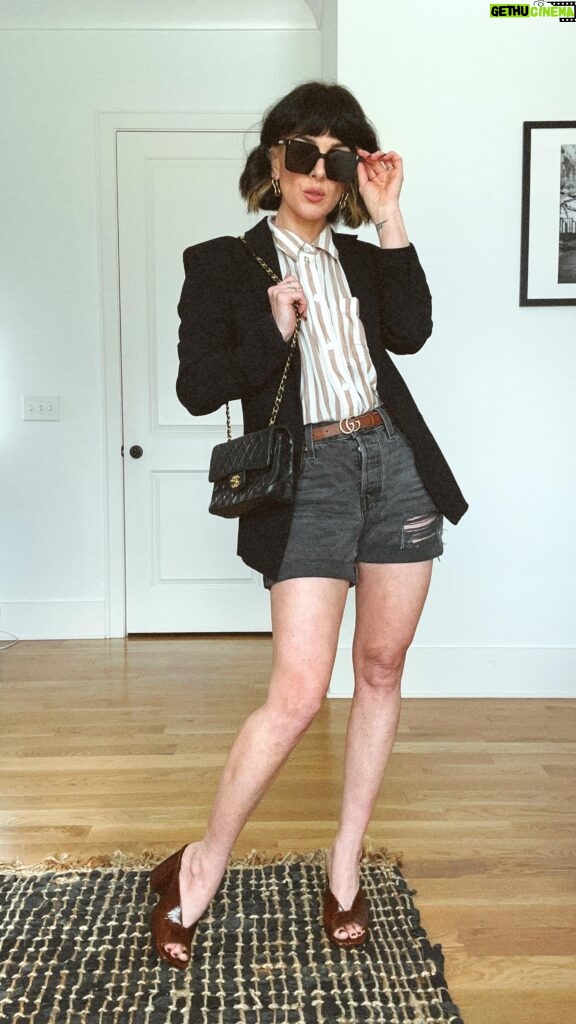 Shenae Grimes-Beech Instagram - Repeating THESE 2 ITEMS all Spring 🌷🌼🌱, don’t mind me! An oversized striped button-down and denim shorts are always my two most worn pieces during this transitional season. Check my stories for some awesome spring deals on denim shorts. I found this button down a few different colors on sale for $27 and under so comment STRIPE if you want info on that! Full outfit is on my LTK now 🖤