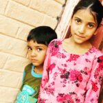 Shilpa Tulaskar Instagram - On my travels, work or leisure, I have been extremely lucky to find the most beautiful faces to marvel at… and eyes that bare souls. Of course they tug away at my heart… Can you guess where this is? The beauty of the faces in the picture is a perfect give away😊. While the little fellow seemed extremely suspicious of me, the sister indulged me when I asked for permission to click them 😊. She didn’t say yes or no. Her eyes and her smile said it all. I’m hungover on the memory.!!! #work #travel #gratitude #eyes #travelphotography shot on #iphone14promax #new #project #apple #appleiphone14promax