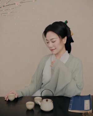 Shirley Chung Instagram - Recent trip back to Beijing, kept the tradition of a new set of studio pictures each time I go to Asia 🥰. 10 hours in the studio, I was transformed into characters from Kung Fu movies I grew up watching 💁🏻‍♀️. Green Hanfu from Han dynasty 💚 Orange and blue Hanfu from Ming dynasty 🧡💙 Jimmy wants to make a large print of #3 photo, and put it on @mschicafe ‘s wall 🫣 and I like #5 . Which one do you think is better for Ms Chi? 🤔🧐 #chefshirleychung #hanfu #hanfugirl #aapiheritagemonth #chineseamerican #mschi #studiophotography #wallart #beijinger