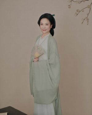 Shirley Chung Instagram - Recent trip back to Beijing, kept the tradition of a new set of studio pictures each time I go to Asia 🥰. 10 hours in the studio, I was transformed into characters from Kung Fu movies I grew up watching 💁🏻‍♀️. Green Hanfu from Han dynasty 💚 Orange and blue Hanfu from Ming dynasty 🧡💙 Jimmy wants to make a large print of #3 photo, and put it on @mschicafe ‘s wall 🫣 and I like #5 . Which one do you think is better for Ms Chi? 🤔🧐 #chefshirleychung #hanfu #hanfugirl #aapiheritagemonth #chineseamerican #mschi #studiophotography #wallart #beijinger