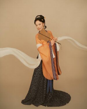 Shirley Chung Instagram - Recent trip back to Beijing, kept the tradition of a new set of studio pictures each time I go to Asia 🥰. 10 hours in the studio, I was transformed into characters from Kung Fu movies I grew up watching 💁🏻‍♀️. Green Hanfu from Han dynasty 💚 Orange and blue Hanfu from Ming dynasty 🧡💙 Jimmy wants to make a large print of #3 photo, and put it on @mschicafe ‘s wall 🫣 and I like #5 . Which one do you think is better for Ms Chi? 🤔🧐 #chefshirleychung #hanfu #hanfugirl #aapiheritagemonth #chineseamerican #mschi #studiophotography #wallart #beijinger
