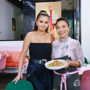 Shirley Chung Instagram - Look who came to @mschicafe and fold dumplings with me?! What a surreal day 🤩🤩 @selenagomez was in my kitchen, folding dumplings, making mochi donuts with me 🥰❤️ We also created a special dish base on her Nana’s chicken and dumpling recipe 🥟= love 💕  Tune in Tomorrow on Food Network, Selena   Restaurant !! 
 
Premiering Thursday, May 2nd at 7:30pm – “Selena   Ms Chi” 
Selena Gomez’s culinary duty brings her to the kitchen of Los Angeles restaurant royalty! Dumpling Queen Shirley Chung welcomes Selena into Ms Chi, where the two make a fusion version of a beloved dish from Selena’s childhood. Selena, Raquelle and Shirley fold dumplings, smoke chicken with tea-leaves and dance around the kitchen before Selena attempts to deliver a dish good enough to make the menu. 
#SelenaAndRestaurant #mschi #dumplingmafiaqueen #dumplings #chickenanddumplings @FoodNetwork @stream.on.max