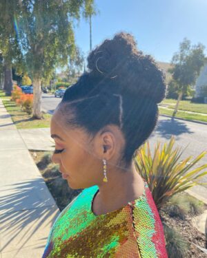 Simone Missick Instagram - ✨✨✨GOLDFINGER ✨✨✨
It’s all in the details... 
Earrings and ring-- 
@ravenfinejewelers
@aimeecarpenter17
Square ring- @hsternofficial 
Hair by @lovingyourhair Makeup by @brittanyingrambeauty Styling by @icurenudity 
Dress: @alexperryofficial 
Shoes: @ysl 
Jewelry styling by @robynvictoriaf