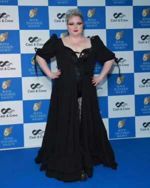Siobhán McSweeney Instagram - I’m scrubbing the shower and noticing I’m covered in soot from cleaning  out the stove and thinking of less than a month again when I was a Glamazon heading to the RTS awards. Thank you again to @_anneoshea_ @nickimakemeup for the whole look  and especially to @loudbodies for the frock. Sustainable, eithical, PLUS SIZED and just beautifully made. I’m in half a mind to put it on to clean the oven. I love it. 
Ye know how cross I get about lack of diverse sizes in clothing. It’s just so boring. And ignorant. And bigoted. And lacking in economical sense. And did I say BORING  But when you get it right *chefs kiss! I think you could agree I look anything but boring in  these photos
Right back to mopping the floors.