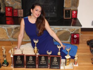 Sona Movsesian Instagram - If you watched the Instagram video posted on the @teamcoco page today then you know these are photos of me with my speech trophies from college. If you didn’t watch the video, then some background: I did a photo shoot with my old speech trophies from college. And I’m giving them away! Info is on the Twitters.