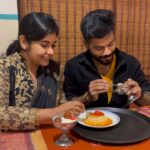 Sruthi Shanmuga Priya Instagram – Epavumae, Naa Athellam vangi unaku tharuvaen kanmani ❤️💕 My lovely food partner and crime partner @arvind__shekar 

Any dessert lovers like us ? Arvind’s favo is kaju Kathi and Kunafa. Mine for jamoon with vanilla ice cream forever ❤️✨

Comment your favourite dessert and go grab it if you crave for gulab jamoon after this video 😀❤️