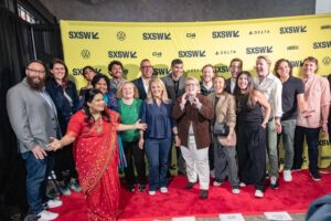 Sunita Mani Instagram - A NICE INDIAN BOY! World Premiere!!! Thank you SXSW and all of you who came out to watch our film! Your support and love were deeply felt 🐬

Some INCRED cast not pictured here: Jonathan Groff, @sachinsahel we missed you! Sas Goldberg, @peterkz—I did see you, SHINE actually, and I love you. Other amazing supporting cast who couldn’t make it, I know you were busy watching Out TV 😎

Thank you to all cast and crew for making this beautiful story come to life. Let’s savor the words that our steadfast director said at the premiere, “Wait…the carpet is actually red…”