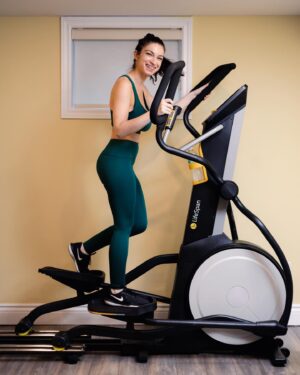 Sydney Ozerov-Meyer Instagram - I tend to really struggle through the winter months, both physically and mentally. Over the years I’ve found that movement helps me enormously with both but I’ve often struggled with the discipline to be consistent with a routine (made worse by how uncomfortable I feel in public gyms). This year I have made it my priority to set up an at home routine that I can maintain before the winter months set in to put my health first in a way that works for me.
An elliptical is my go to. It’s super low impact for my joints, an amazing full range of motion and great for a warm up or full workout. I was geeked to find the @lifespan_fitness elliptical that somehow requires no power and yet has a full digital program? It’s the perfect stride length and has a 30 day money back guarantee. If there’s one piece of at home gym equipment that felt essential to my winter setup. This is it. Wish me luck!!