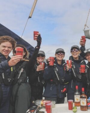 Talulah Riley Instagram - 🏴‍☠️ Hanging (literally) at the top of the mast of a 52’ yacht... @cowes_week was awesome fun 🏴‍☠️ 

🌊 We came last in our race. By 40 minutes. The spinnaker sheet got tangled around our engine. We tore our jig-sail. The cutlery drawer below deck came out and sent knives and forks whizzing everywhere. And we bumped into a huge yacht when mooring… but everyone kept their full compliment of fingers, and no one got hit on the head by the boom. 🌊 

💙 A BIG thank-you to @mustoclothing for kitting us out with proper sailing gear. I have loved you forever (used to wear your jackets out riding as a little girl). And thank you @chathamfootwear — not worn boat shoes before and now never want to take them off. They’re as comfortable as slippers!! 💙

🍹It was exciting when the  @mountgayrum boat came and delivered drinks (even kindly providing ginger beer for us non-drinkers. Or maybe I stole the mixer..?). Thomas was so rum-happy he held his cup right in front of my face for the photo…🍹

🦞 Oh, and I got so very sunburnt that my lips actually swelled up. I didn’t know that could happen. 🦞

✨We had the calmest, nicest skipper imaginable. Thank you very much @germaine_sail ✨

And top, top, talented team mates: @victorilou @charlottehawkins1 @chrisrobshawrugby @camillakerslake 

📸 Thank you @maxcisottiphotographer for your excellent company and action shots 📸 

And thank you @zafrushdie and @greenroomvip for the whole experience xx