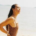 Taya Rogers Instagram - ✨🌞✨🧡 Stay aligned with your own energy & let people meet you there. In my element, sand under my feet, sunshine on my skin, ocean air, 📸 caught on 🎞️ by @j.m.j___