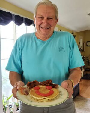 Terri Runnels Instagram - I made my sweet Dad his first ever "Smiley Face Pancakes", with curly Bacon hair this morning 🌞! He was quite tickled with them and the LOVE that comes with them!  @dakotarunnels22 knows ALL about the SFP, as she was the impetus for me making them 26 years ago! 🥞❣😍🤗