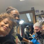 Thandiwe Newton Instagram - NOW I’m home. Got my post @westworldhbo Season 4 ink done by my homeboy @miles_chappers Every milestone is marked by Miles. Booker came along to watch. He designed a tattoo for me too, thank you baby. @frithsttattoo ☠️ go hard or go home Xx Thandiwe Oh yeah - wearing @ashish dope hoodie and @chanelofficial watch @bella_freud sparkly leggings that you can’t see 😋 And @sacaiofficial boots that I want grafted onto my ankles like permanent hooves. I pissed IN the f***ing toilet 🙏🏽