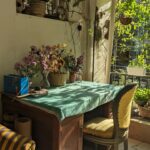 Tillotama Shome Instagram - My favourite corner at home. Dadu's writing table. A very old table cloth. Dried flowers. Fresh flowers ( fresh even after 11days @konkona !!!) Book Chotu speaker Embroidery threads.