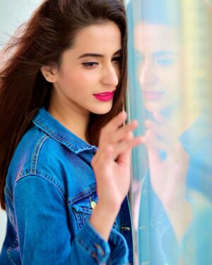 Tithi Raaj Instagram - Got no #time 
Got no #mind 
For the line 
Time to sink way into the blue , dear #💙 
.
#blue #denim #denimjacket #love #glass #eyes #mirror #reflection #mindset #allthingsart