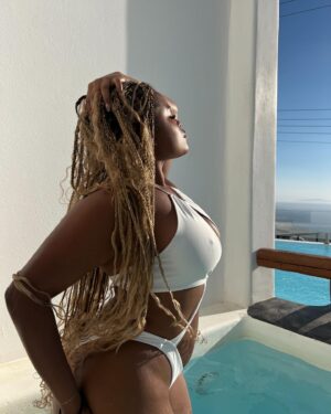 Tyla Gomez Instagram - it’s not about having someone to love me anymore🤍 santorini has my heart ///

outfit details:
first pic @lulus 
White swimsuit@whitefoxboutique 
Yellow dress @revolve 
Orange bikini @knightswim 
pink swimsuit @revolve