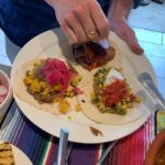 Ulrika Jonsson Instagram - So. Everyone who knows me well, knows this is my happy place. Cooking. Hosting. Table-laying. Flower arranging. Making a fuss. Paying attention to detail. And generally wearing myself out. Third Ungrateful requested tacos for her 18th. And she got more than she bargained for. Beef fillet tacos. Pork Carnitas. Courgette, corn, shallot, mint, feta tacos. Guacemole. Too much cheese. Pink pickled onions. Refried beans. Sriracha mayo. Chargrilled corn. And pineapple (just cos). All the trimmings. A lot of rum and limes. And Frida Kahlo came, too. Hostess with the mostest. And yes, ALL Mexican people have moustaches and wear sombreros. Fact.