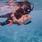Valentine Thomas Instagram - Party of 2 getting it done. Almost 7 months in. I was pretty stocked to get a mutton snapper as it’s not an easy fish to get. Can always count on @redtidespearfishing gear (and for the male wetsuit so I could fit in it 😂)! And @laurensarasua made an absolute feast with it 😍 So grateful that my daughter will have those incredible ladies as an example around her 😍 We caught, cleaned and cooked (and let the boys clean ha!). #fishing #spearfishing #catchcleancook #pregnancy #semidomesticated 📷 @ggerbasi