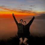 Victoria Spence Instagram - Mount Batur for sunrise with my childhood best friend is a memory ill savour forever 🫶🏻🌅🥹 swipe to see our visitor on the way down🙊 I swore I’d never do it again after last year, but it turned out to be way easier when I didn’t have the 💩’s , although whoever rated it easy to moderate on google- are you alright?! 🥲 If you’re coming to Bali, I promise the 1:30am wake up is worth the views from The top 🫶🏻#bali #mountbatur #friendship