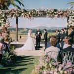 Virginia Gardner Instagram – Actress Virginia Gardner and musician Jed Elliott wanted “an explosion of fun” for their Napa Valley wedding. “The element that I kept coming back to for the wedding, that I wanted to be reflected in the floral, in the dance floor, in our ballroom, was celebrating California for what it is and its beauty and the florals,” Gardner says. “I also wanted it to feel whimsical and not too stuffy or too serious.” 

Take an exclusive look inside the ceremony at the link in bio. Photos: @seanthomasphoto
