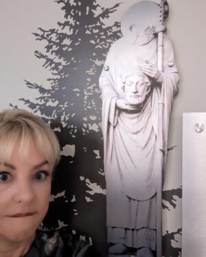 Wendi McLendon-Covey Instagram - Fun fact about me.... I hate going to the doctor, and for years I've said, "The only way you'll get me to go to the doctor is if I'm holding my severed head in my hands." Well now I'm on a show that takes place in a hospital  called St. Denis Medical, and here I am standing next to a picture of St. Denis, who had his head cut off and just kept on preaching the gospel. Coincidence, or major manifestation? Discuss!