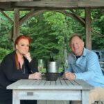 Wynonna Judd Instagram - Part 2 ✌🏼 of last week’s birthday festivities! Everyone who knows me, knows that I am not a fan of surprises!!! I knew that something was planned for my actual birthday, but wasn’t sure what. I was told to drive to the gazebo (where Cactus and I got married) at 6:30pm. We arrive, expecting a group of people to yell “surprise!” Much to my surprise, we find nothing besides a bottle of champagne and two glasses. 🥂 A peaceful, quiet moment with my sweetheart in the midst of a very busy week. We’re then instructed to drive to one of our favorite spots on the farm, a spot we’ve recently named “Peaceful Creek.” My dear family and chosen family have gathered for the most beautiful dinner IN the creek, and even flew in one of my favorite chefs @chefbobbymarcotte to cook for us. Thank you to everyone who understands my heart’s desire! Family, friends, and fellowship at my favorite place on earth…HOME. 💛 📷: @hayleyshoots