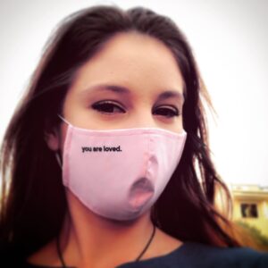 Xenia Goodwin Instagram - When people can’t see you smile at them anymore, at least we can tell them that #youareloved thanks @khanhong and @youarelovedworld for this special mask, helping a special cause.  YOU ARE LOVED! ❤️ *EDIT* For those commenting that I should not wear a mask, or whether I have COVID-19 (I do not), please consider that each individuals personal circumstances are different.  I currently reside in a retirement village next to a nursing home, with aged care facility restrictions, it’s not a hard measure to take to keep others happy.  Regardless of opinion remember that #youareloved and respected.  Cheers legends 🍻