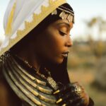 Yaya DaCosta Instagram - is MOOR. The Moors were a predominantly Muslim people originating in North Africa (modern day Algeria, Morocco, Mali, Mauritania, Tunisia, Niger) and the Iberian Peninsula in the Middle Ages. Between 711 C.E. and 1492 C.E. Moors ruled over Iberia, which consists of modern-day Spain and Portugal. Our introduction of new scientific techniques and tools to Europe accelerated progress in Moorish Spain and made it flourish in the areas of Astronomy, Chemistry, Physics, Mathematics, Geography and Philosophy. . Channelled message: Trust in the changing nature of life. The reality that you perceive today is but an expression of the energy needed to cultivate the transformation of Earth at this time. Do not cling to notions of “good” and “bad”. The next phase will always come. Take a step back and see the circumstances of this lifetime as but a brief moment in the grand lifetime of humanity. The power scales shall shift again and again. We have conquered the people who have conquered us. See the humans around you as reflections and reminders of every possible experience within you; of every feeling that is also possible within you; of every action - positive or negative- that is also a possibility for you. Contribute with compassion to humanity’s ascension to a place where its goal is no longer power, but Love. Inshallah. . . 📸: @thaisaquinophotography 💇🏾‍♀️: @chiomanvhair 🎵: Khalifa Ould Eide, Dimi Mint Abba “Hassaniya Love Poem” . #AncestryDecolonized #BlackFuturism #IndigenousFuturism