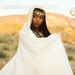 Yaya DaCosta Instagram - is MOOR. The Moors were a predominantly Muslim people originating in North Africa (modern day Algeria, Morocco, Mali, Mauritania, Tunisia, Niger) and the Iberian Peninsula in the Middle Ages. Between 711 C.E. and 1492 C.E. Moors ruled over Iberia, which consists of modern-day Spain and Portugal. Our introduction of new scientific techniques and tools to Europe accelerated progress in Moorish Spain and made it flourish in the areas of Astronomy, Chemistry, Physics, Mathematics, Geography and Philosophy. . Channelled message: Trust in the changing nature of life. The reality that you perceive today is but an expression of the energy needed to cultivate the transformation of Earth at this time. Do not cling to notions of “good” and “bad”. The next phase will always come. Take a step back and see the circumstances of this lifetime as but a brief moment in the grand lifetime of humanity. The power scales shall shift again and again. We have conquered the people who have conquered us. See the humans around you as reflections and reminders of every possible experience within you; of every feeling that is also possible within you; of every action - positive or negative- that is also a possibility for you. Contribute with compassion to humanity’s ascension to a place where its goal is no longer power, but Love. Inshallah. . . 📸: @thaisaquinophotography 💇🏾‍♀️: @chiomanvhair 🎵: Khalifa Ould Eide, Dimi Mint Abba “Hassaniya Love Poem” . #AncestryDecolonized #BlackFuturism #IndigenousFuturism