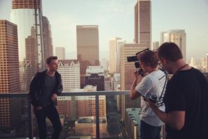 Aaron Marciniak Instagram - BTS: another great BTS photo from @jeffreyfuente decided to take the reigns as my #alexamini had to get inches away from the edge of 34 stories up. Fun times @turnercine @cody_jay_music @claurakiehl #arri @arri #director #alexa #home #adventuretime #life @birnsandsawyer