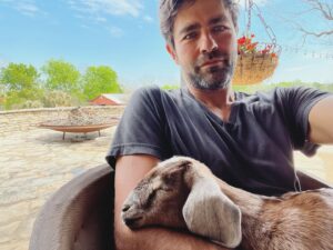 Adrian Grenier Instagram - Don’t be deceived. This baby goat was ripping my arm hair out like she was grazing in a field about 3 minutes before this picture. 

#goat #baby #cute #home #homestead #homesteading #farmlife