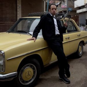 Ahmed EL-Ghandour Instagram - “Ahmed El Ghandour, the renowned entertainer known for his iconic character ‘ @eldaheeh ,’ returns to his beloved hometown of El Mansoura with an enigmatic new persona that is captured by Mostafa Ahmed’s distinguished video portraits. We witness the mysterious figure strolling through the neighborhoods and streets of El Mansoura, leaving residents and fans both intrigued and confused”

Shots by: @moosta_ahmed 
Stylist: @omarelsaied_ 
Production & mgmt: @ripple.mgmt 
BTS: @viewmansoura & @omarelsaied_ 
Special thanks to @kareemelbaz_ & gugar fans.