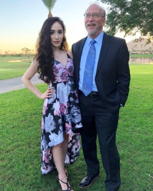 Ainsley Bailey Instagram - happy father‘s day to my perfect & adorable dad who i selfishly wish could be at all my shows because he has the best laugh in the world 🏆✨
1. this pic is like 6 years old 
2. my dad’s name is Ken 
3. my dad watching tape of one of my old standup sets that definitely did not warrant this amount of laughter 
4. my favorite text I’ve ever received from him
5. My dad sounding like Matthew McConaughey in a home video 
6. JANSPORT