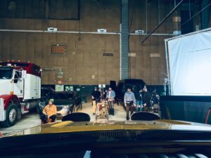 Alan Ritchson Instagram - You’re playing Reacher. You started filming the season in the summer, but a strike pushed you into the bitter cold of an uninhabitable Toronto winter. As a result, the driving scenes aren’t so drivey anymore.

The windshield has been removed so the camera doesn’t see itself. It’ll be put back in in post. Everyone has on eye protection but you. Zirks are being shot at you from all sides. They’re basically paintballs filled with black powder, zirconium and bird seed. They can start a fire and they definitely create a debris field. Your eye twitches at the thought one clipping your dusty retina. 

You’re tasked with driving across a property that currently only exists in your mind, while the camera pushes into your face through an invisible windshield and you’re blasted with the Golden Corral of bird food. 

To complicate matters further, the car is off so the fumes don’t turn the soundstage into the Jonestown Massacre. Which means there’s no power steering and the tires are under 8 thousand pounds of truck. The steering wheel makes you look weak. Everyone laughs at you. You take solace in the fact that a Craig’s cookie isn’t too far away. You love cookies. You eat them all the time. 

Can you sell the explosive drive without over doing it? Or are you driving Miss Daisy?