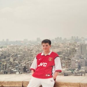 Alex Brooker Instagram - Throwback to this Lego-haired legend rocking an Arsenal shirt and white Reebok poppers in Egypt #GeezerinGiza