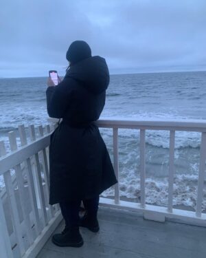 Alexandra Krosney Instagram - If I don’t stand in the rain, filming the ocean for no reason, who will?