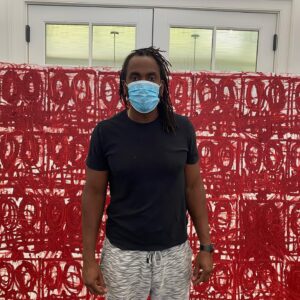 Alexandra Munroe Instagram - I thank Rashid Johnson for my first live studio visit in five months! Here he stands before one of his amazing new works, where he paints “anxiety” in a blood red of his own manufacture. He calls these marks “traffic”, sees the grid of ovals as faces, and includes a date in each title, to mark the identity of this historic time.  He wears Ai Weiwei MASK. 

@rashidjohnson @guggenheim @hauserwirth #anxiety #artinthetimeofcovid @aiww #aiweiweimask #gratitude