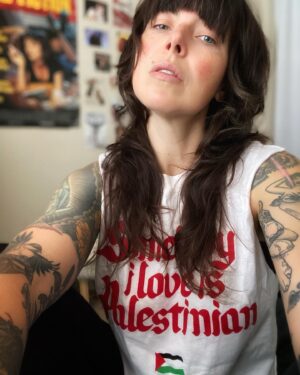 Alexis Krauss Instagram - what does protest look like for me now as a sleep deprived and over scheduled mother of a 7 month old?

for now it’s sitting in my little cousin’s bedroom while my baby naps taking selfies in this t-shirt designed by @sabri. shirt sales support mutual aid for Gaza

it’s no radical act but for now it’s what i can do. i struggle everyday thinking about how to express my outrage over what continues to happen in our world. i truly believe that even the smallest acts matter. keep feeling, keep having conversations with loved ones. keep mothering and keep loving with all your might. keep protesting even if your capacity is limited. it all matters.