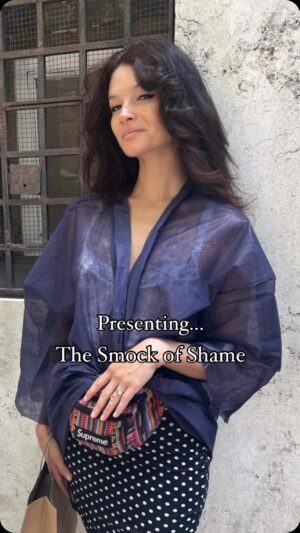 Alice Greczyn Instagram - There I go again, distracting my brothers in Christ. 😂 I’m in Italy and the friars at the ossuary made me buy a modesty smock to cover my shoulders (common in “holy places”). Not a #religioustrauma trigger at all! If you read my book, you know, lol.

#purityculture #modestyfashion #wheninrome #exvangelical #humor #triggered #exchristian #exvangelicals #stumblingblock #gilead #walkofshame #smockofshame #stumblingblock