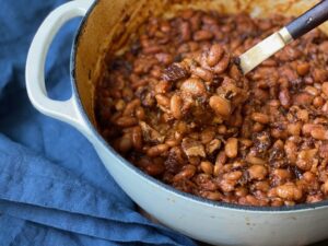 Alton Brown Instagram - This application riffs on pork-and-beans and classic Boston baked beans. The molasses helps to keep the cooked beans whole and distinct, while jalapenos and cayenne give them just enough kick.

#linkinbio #summersides #backyardbbqrecipes #onceandfuturebeans #molassesbakedbeans #4thofjulybbq
