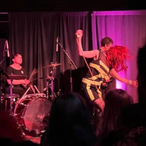 Amanda-Faye Jimenez Instagram - Finally getting around to June/Pride dump. So appropriately #femmefriday and appropriately Barbie Friday tbh because so many icons herein wowow!

🩷 lesbian flag nails
🩷 fangirling over performing with @kirstenvangsness at @sororitytheatre Waves 
🩷 First annual Disney Gays and Disney Adults Are Not The Same Thing But Yeah This Is The Best Night Of Our Lives Summit aka Disney Pride Nite
🩷 My heartthrob Poodle!!
🩷 Let’s Go Sparks (clap clap clap clap clap)
🩷 lesbian flag (inspired) nails
🩷 with one of my personal heroes and femme icon @guinevereturner signing her incredible memoir When The World Didn’t End
🩷 Peaches Pride @queerlybelovedsf 
🩷 my @ashashashashashashley 
🩷 Bratmobile show with my angels @kpepe and @samiterrestrial