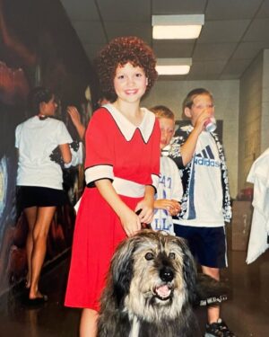 Amanda Jane Cooper Instagram - It’s World Theatre Day! “Come what may…”, 🎶 I’m so thankful to create on stage. And for the folks who believed in this eleven year old girl & beyond. No one does it alone. 

Today I’m thinking of Susan Messner, Lisa Eaton, Bob Morris, Glenn Kinckner, Paul Spencer Adkins, Gary Kline & all my @cmudrama professors, @kent.gash, @wickedschwartz, @burnscraig, my family, Joan Lader, @irish_rep, @sacmusicals, @braveartistsmanagement and SO many more! Thank you for giving me a chance to live a dream. The adventure continues. 

Also: A few days ago was National Puppy Day, so let’s hear it for Sandy!! 

“You’re always a day away…” 🎭