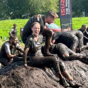 Amy James-Kelly Instagram - TOUGH MUDDER NORTH WEST 2023
••••
15km of mud, water, hills, and the wackiest obstacles since Richard Hammond and his Big Red Balls.
••••
Like Fall Guys, but real life, and you don't bounce if you fall. And you pay to do it. And you hurt for days after. And you run for way more than a couple of minutes. And there's no bright colours, it's all just grass and mud. So it's nothing like Fall Guys really. 
••••
I've been nervous about this for months - two surgeries later and I'm negotiating this event with a body that needs to do more than just train to run for a bit... There were obstacles I was on doctor's orders NOT to attempt (and I didn't, dw) But I conquered it. All 15k. And when I had to miss out an obstacle (like the two that electrocute you) I made sure I pelted it to the next one, just so no one could say I had an easy day of it 😜. We all crossed the finish line together, caked in mud, water, sheep shit, blood and sweat. And dya know what? I had a belting time. I have crap upper body strength so fell off every single set of monkey bars I crossed paths with (into the most horrible 'water'), but I did do two obstacles that triggered my claustrophobia so I'd say I redeemed myself...
••••
Matt, Will, Andy and of course Dan, who I absolutely not in a million years could have done this without, right from training to pulling me up the last few feet of that wall as I dangled from his arms. (And there's evidence within these photos that he had rather a nice time assisting me too, I guess... 😜)
••••
Can't wait to see the official photos from the event and be greeted by some ridiculous shots of me going arse over tit... @toughmudder