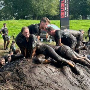 Amy James-Kelly Instagram - TOUGH MUDDER NORTH WEST 2023
••••
15km of mud, water, hills, and the wackiest obstacles since Richard Hammond and his Big Red Balls.
••••
Like Fall Guys, but real life, and you don't bounce if you fall. And you pay to do it. And you hurt for days after. And you run for way more than a couple of minutes. And there's no bright colours, it's all just grass and mud. So it's nothing like Fall Guys really. 
••••
I've been nervous about this for months - two surgeries later and I'm negotiating this event with a body that needs to do more than just train to run for a bit... There were obstacles I was on doctor's orders NOT to attempt (and I didn't, dw) But I conquered it. All 15k. And when I had to miss out an obstacle (like the two that electrocute you) I made sure I pelted it to the next one, just so no one could say I had an easy day of it 😜. We all crossed the finish line together, caked in mud, water, sheep shit, blood and sweat. And dya know what? I had a belting time. I have crap upper body strength so fell off every single set of monkey bars I crossed paths with (into the most horrible 'water'), but I did do two obstacles that triggered my claustrophobia so I'd say I redeemed myself...
••••
Matt, Will, Andy and of course Dan, who I absolutely not in a million years could have done this without, right from training to pulling me up the last few feet of that wall as I dangled from his arms. (And there's evidence within these photos that he had rather a nice time assisting me too, I guess... 😜)
••••
Can't wait to see the official photos from the event and be greeted by some ridiculous shots of me going arse over tit... @toughmudder
